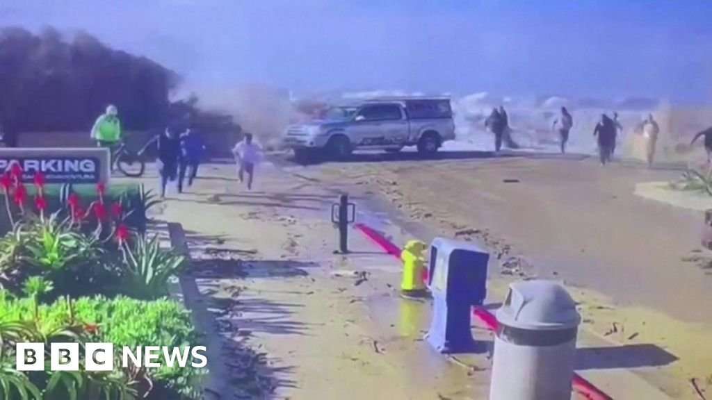 Beachgoers swept away as huge wave crashes over wall in California