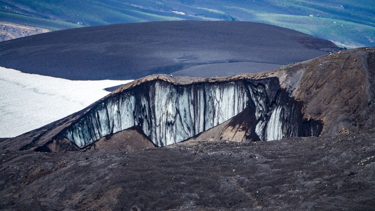 A sinkhole in the permafrost shows thawing due to climate change