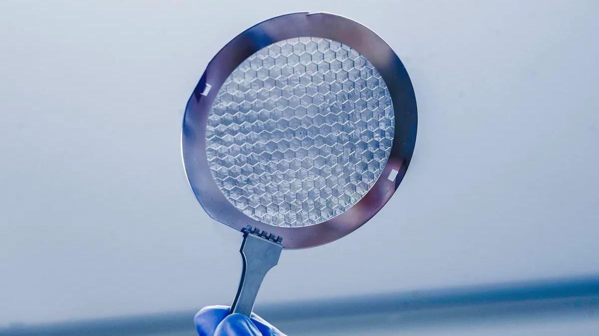 an 8 inch wafer of silicon with hair thin panels etched with microscopic holes