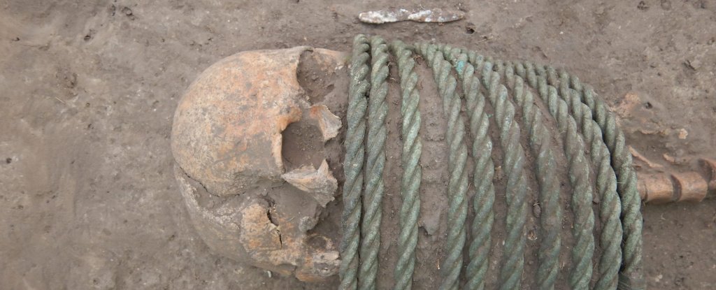 Dark Age Skeletons Uncovered With Buckets on Their Feet And Rings Around Their Necks ScienceAlert