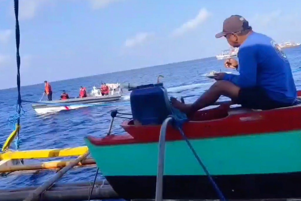 Defiant fisherman tells Chinese coast guard to ‘go away’ from disputed territory amid rising tensions