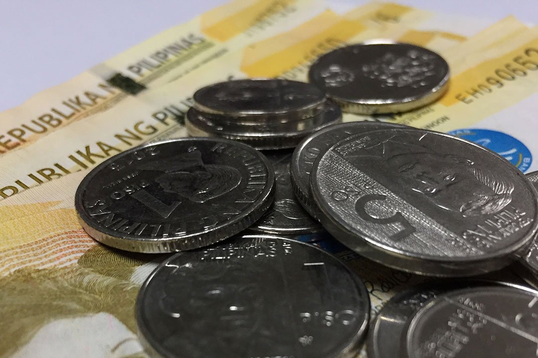 Peso breaches P56 a dollar level on policy rate easing signals from BSP