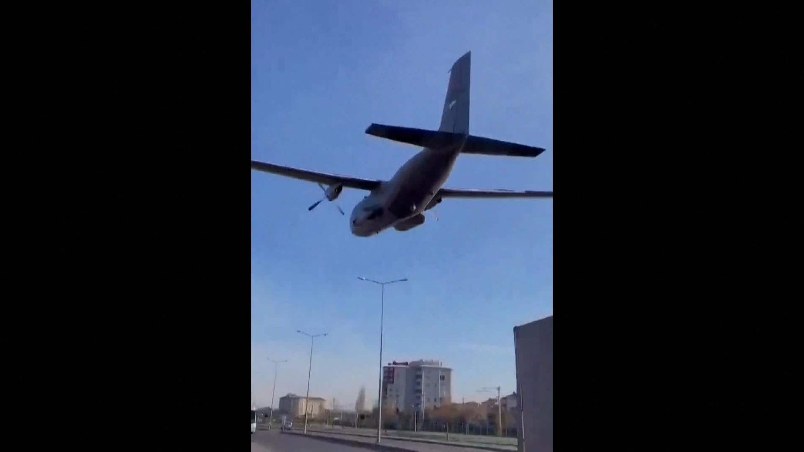 Turkish military plane buzzes right over streets field