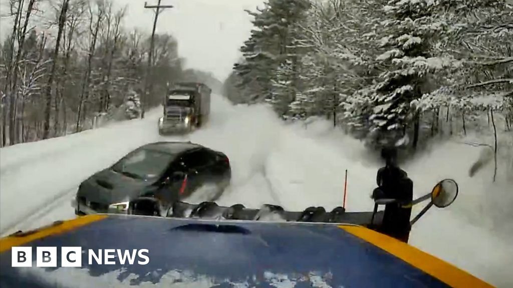 Video shows car crash into snowplough on icy road