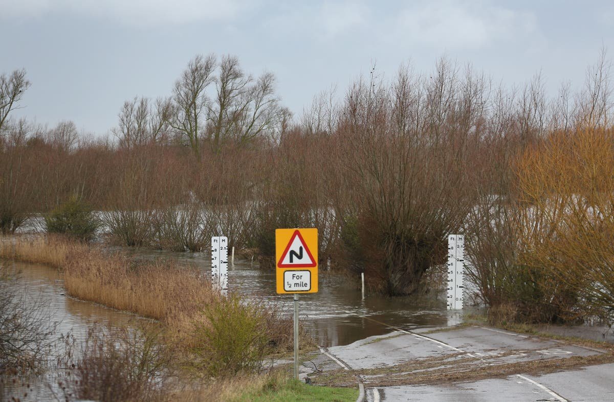 Flood warnings in place across England and Wales as heavy rain and strong winds