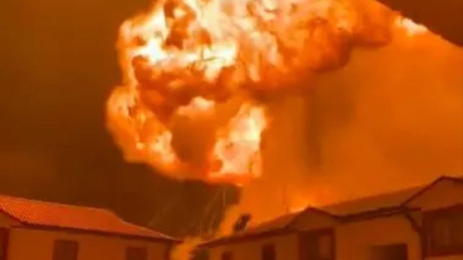 Terrifying mushroom cloud of flames erupts yards away from apartment blocks in Kenya as terrified residents flee