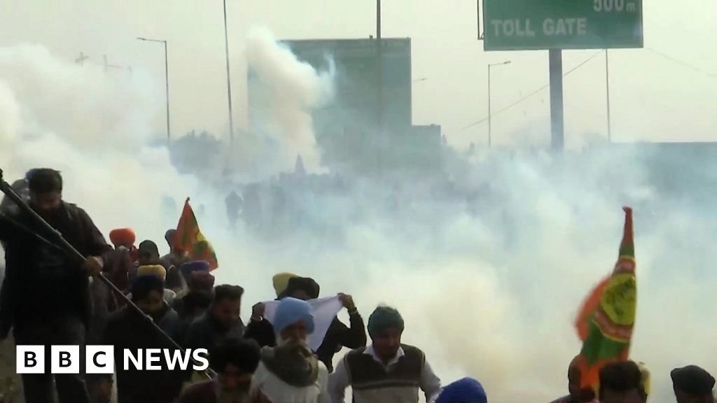 Watch Indian police fire tear gas at protesting farmers