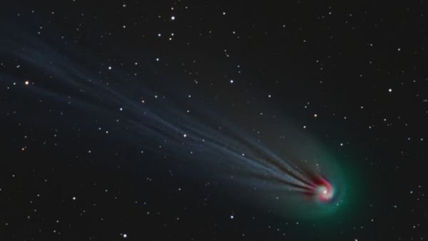 Explosive, green ‘devil comet’ has hidden spiral swirling around its icy heart, photo trickery reveals