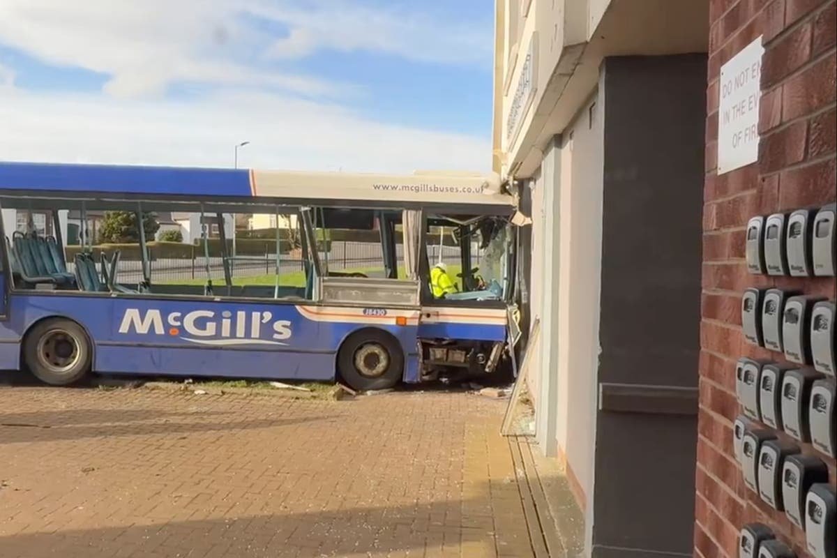 Five hospitalised after bus crashes into block of flats in Paisley