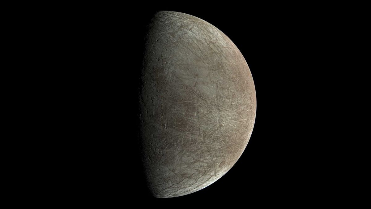 the icy jupiter moon europa against the blackness of space