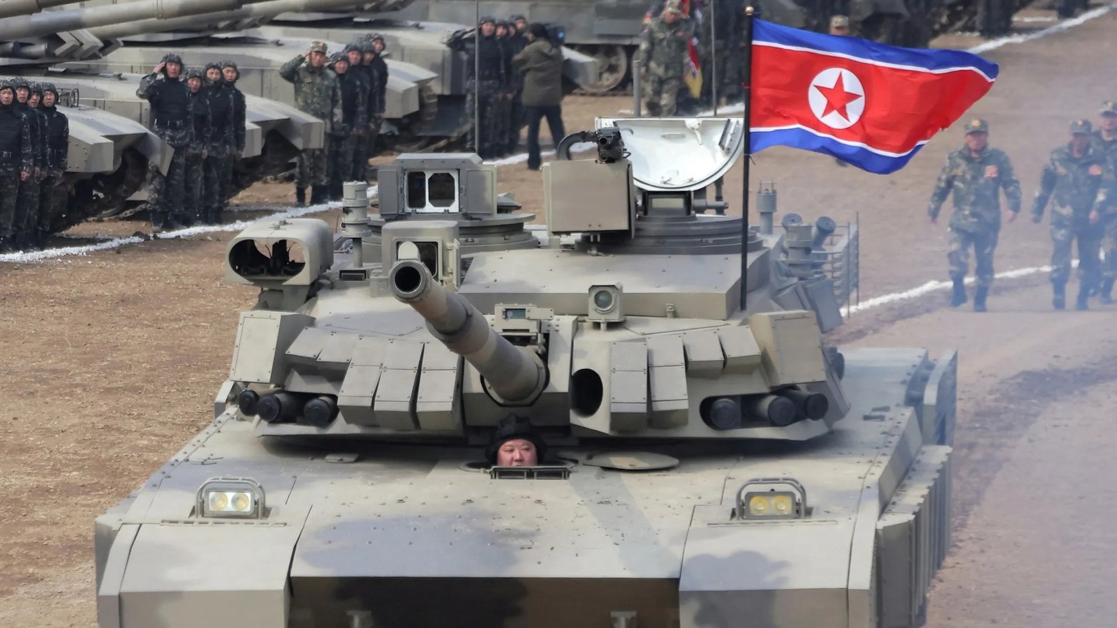 Kim Jong Un pops head out of tank as he unveils new war machine in face of US military exercises