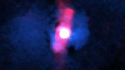 A composite image of the quasar H1821+643 with X ray data from Chandra in blue and radio wavelength data from the Very Large Array in red showing the lobes of the radio jets which are aimed almost directly at us