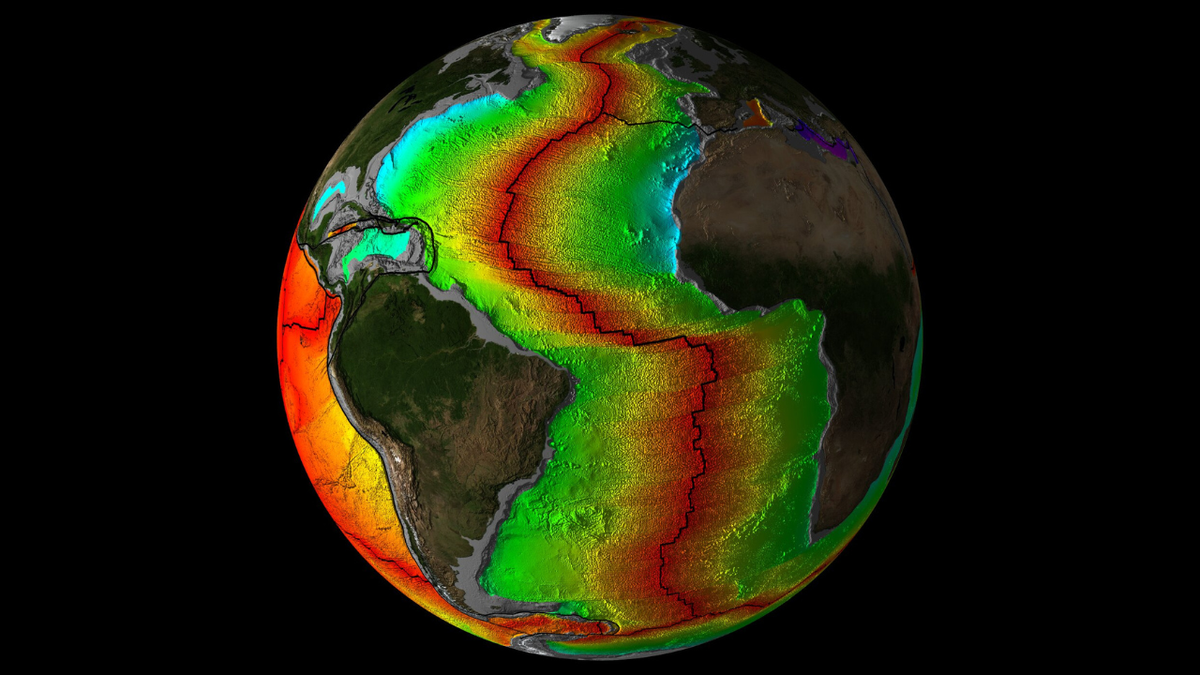 a false color image of earth showing large sections of crust beneath the world