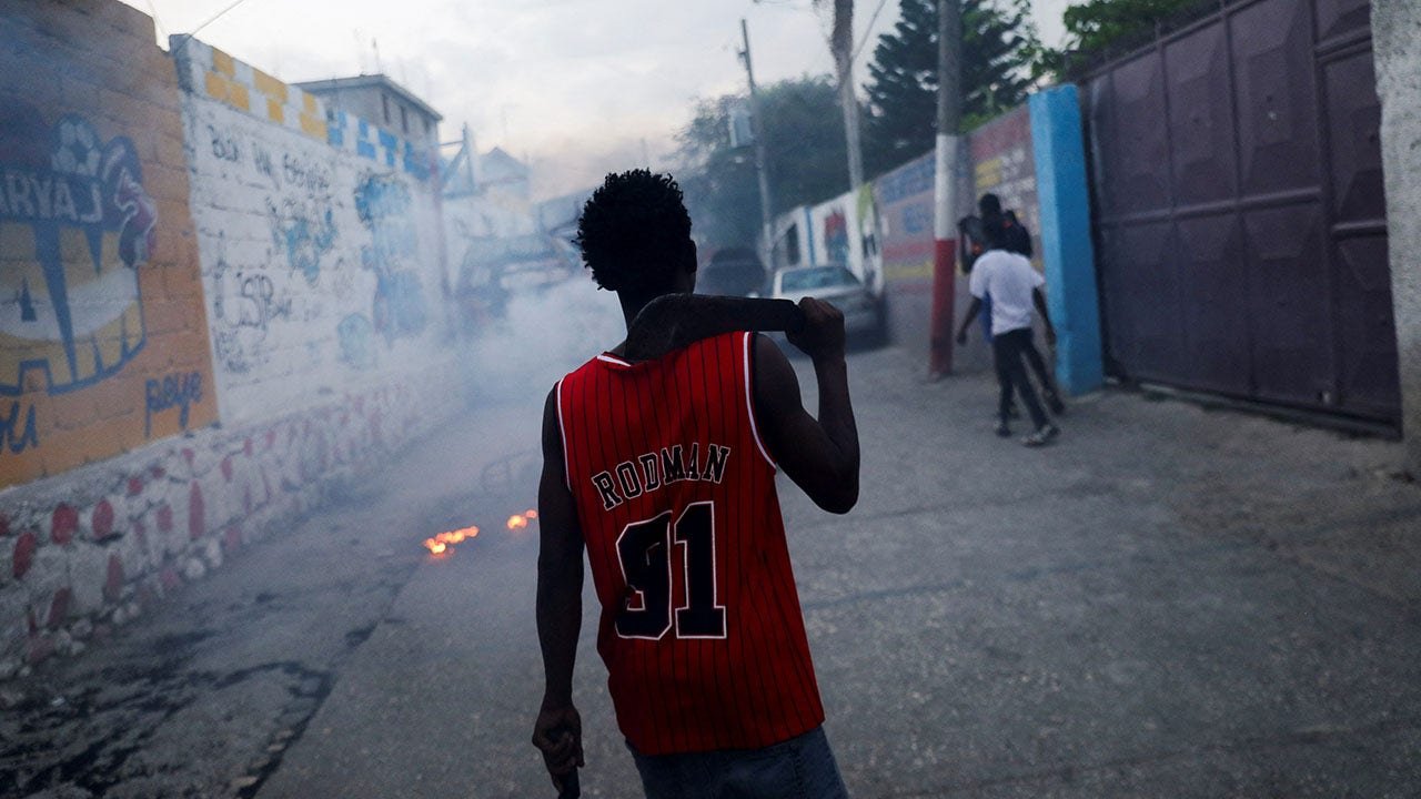 Suspected Haiti gang members killed, set on fire: report