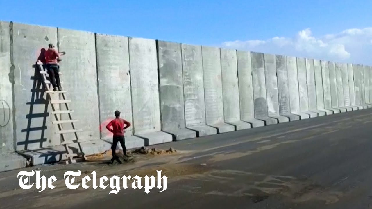 Egypt builds large cement wall at Gaza border, for aid ‘logistics zone’ officials say