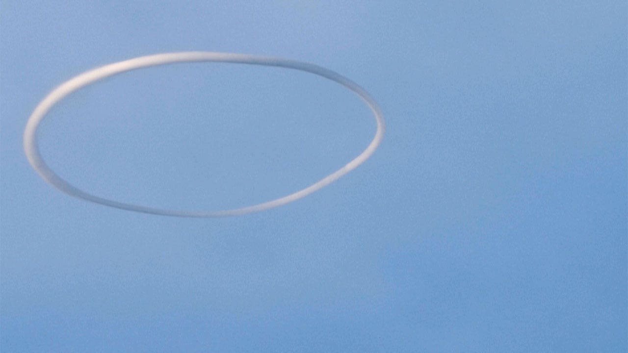 Blowing smoke Mount Etna puts on a show by emitting rare rings into the sky