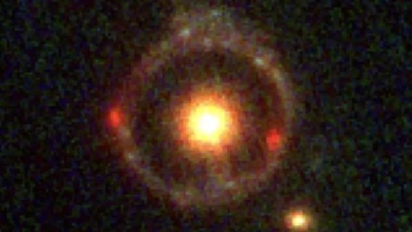 Exotic ‘Einstein ring’ suggests that mysterious dark matter interacts with itself