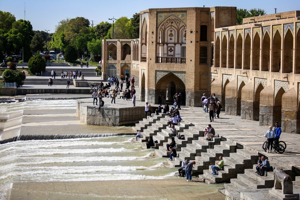 People visit the Khaju Bridge in Iran