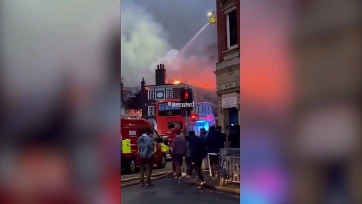 Watch: 80 firefighters battle raging blaze as historic London pub | News
