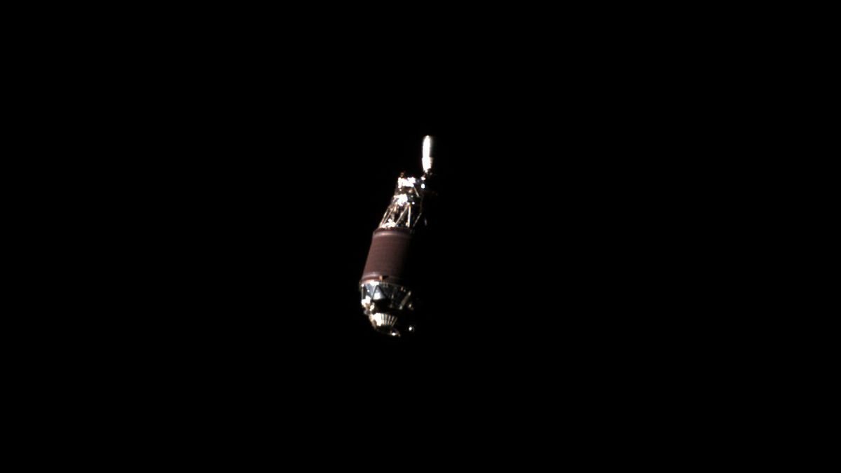 up close photo of a rocket upper stage in the blackness of space