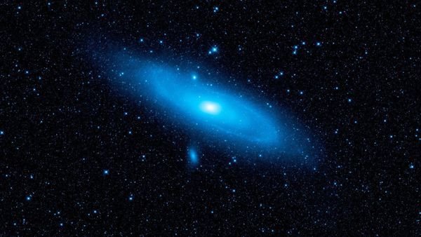 The nearby Andromeda galaxy with older stars highlighted in blue A new theory of quantum gravity could help explain why more distant galaxies seem to be retreating faster than nearer ones