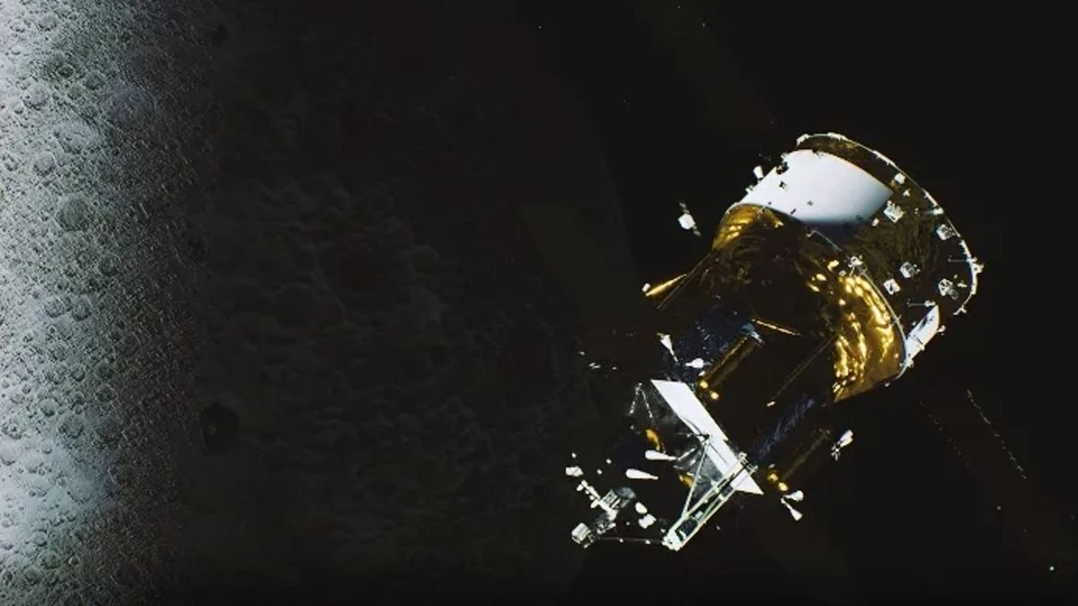 a gold foil covered cylindrical spacecraft above the moon
