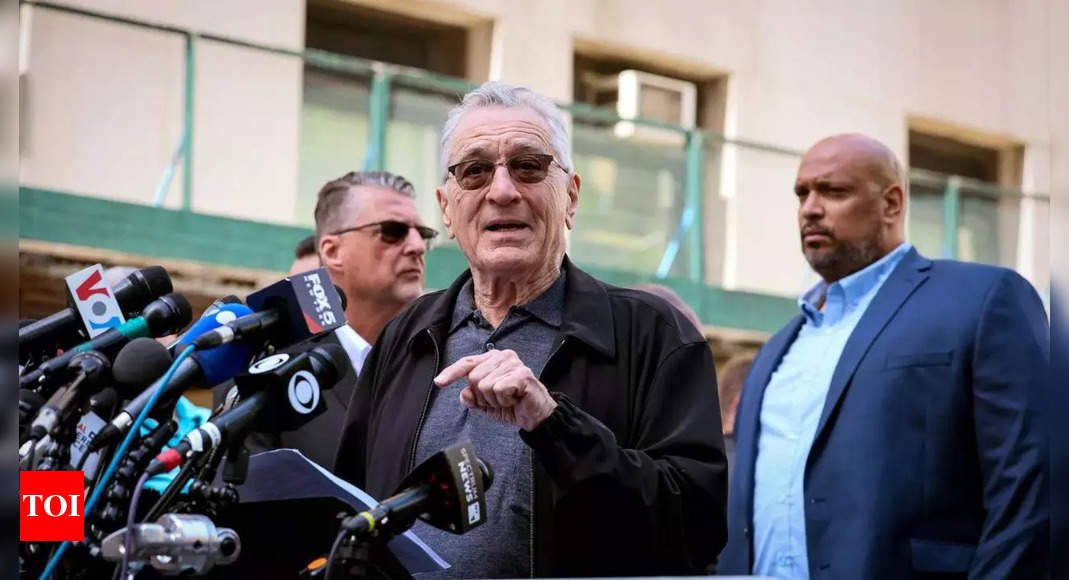 De Niro calls Trump supporters gangsters in heated exchange outside court