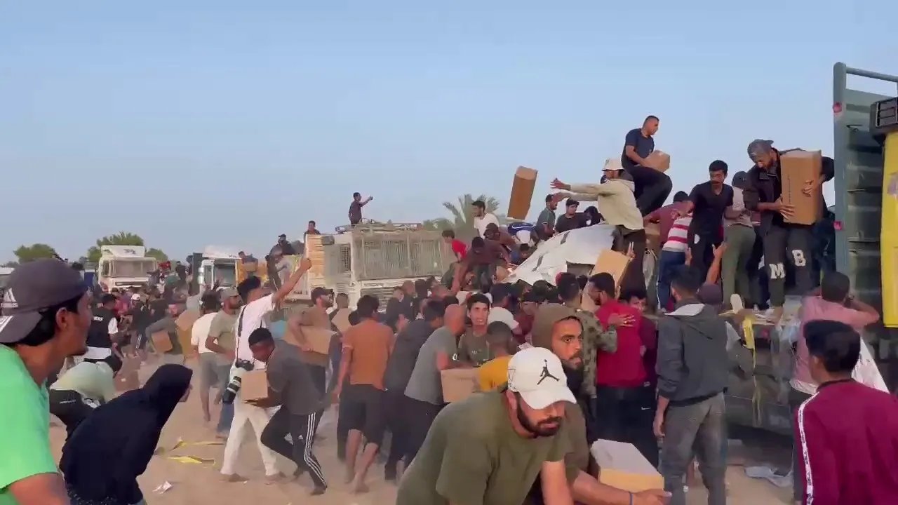 Footage shows hundreds of Palestinians looting aid convoy in Gaza, blocking delivery from US pier