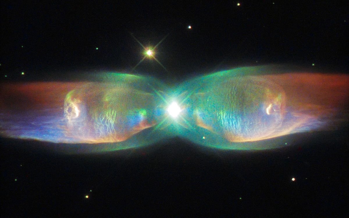 Over 4200 light years away this cosmic butterfly takes an odd two lobed shape
