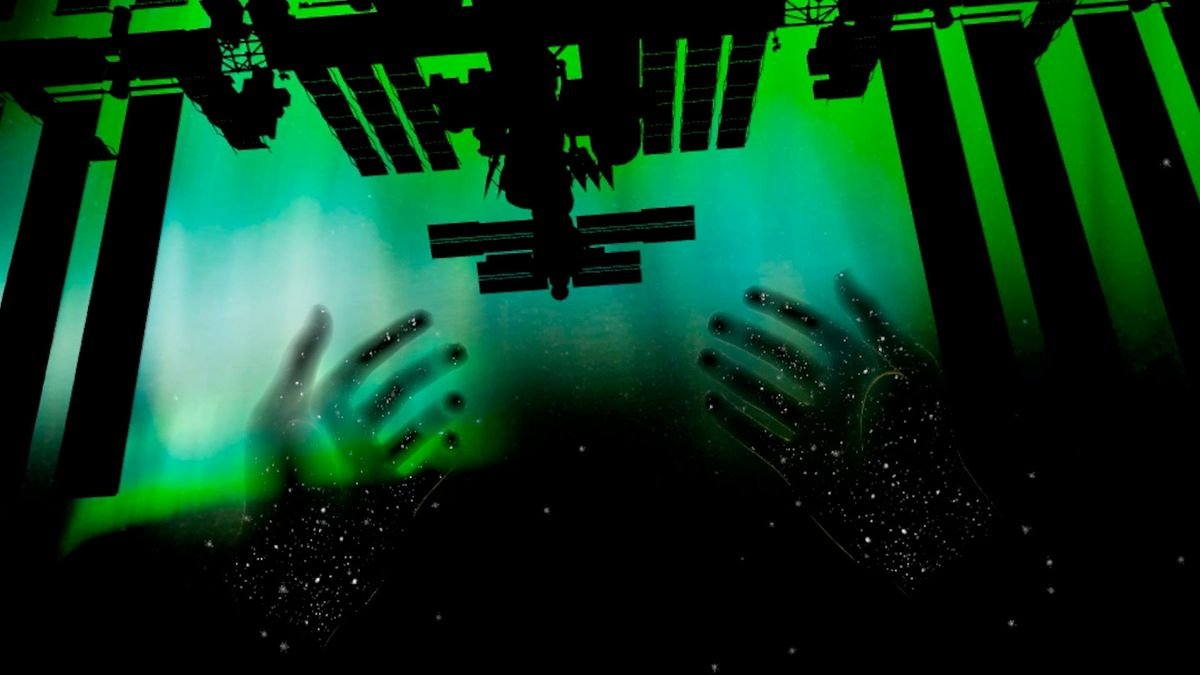 the black silhouette of the international space station is seen against a green screen with the outline of two hands beneath it