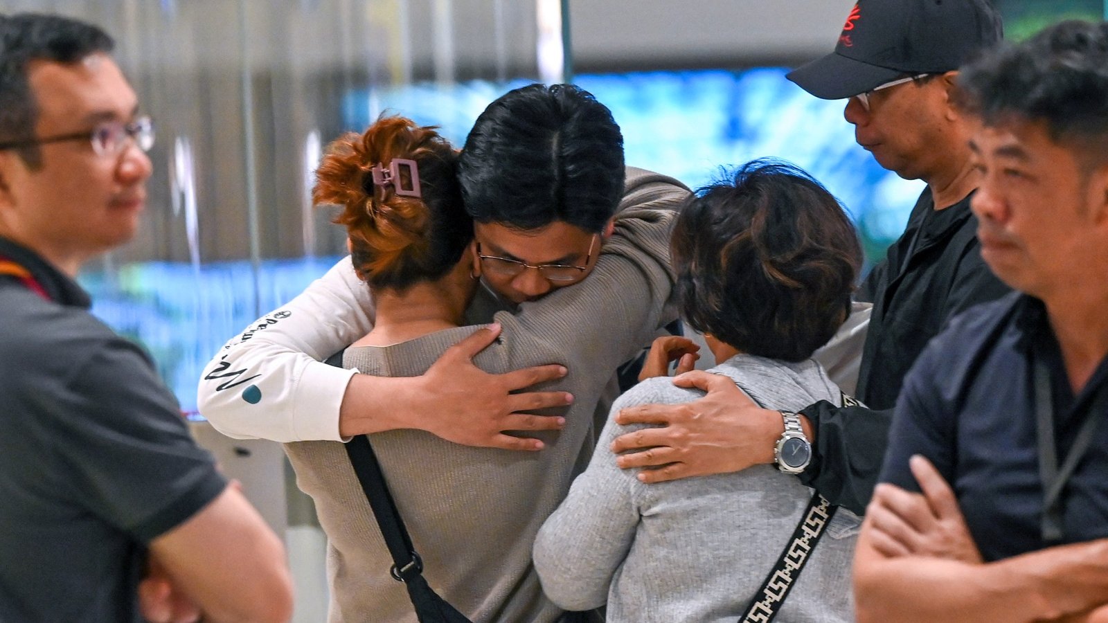 Passengers ‘did somersaults’ in 7,000ft drop that killed granddad, 73, as Singapore flight survivors greet loved ones