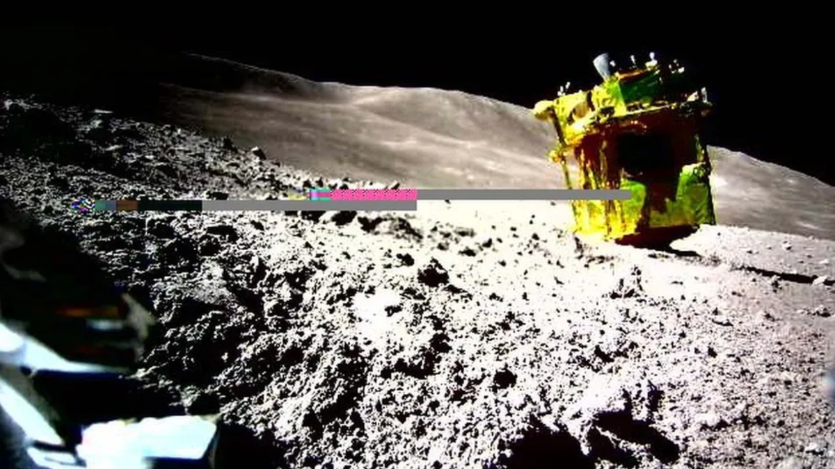 A yellow colored spacecraft is upside down on the moon There
