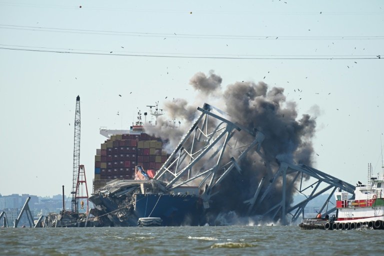 Crews conduct a controlled demolition of a section of the Francis Scott Key Bridge resting on the Dali container ship in Baltimore on May 13 2024 ROBERTO SCHMIDT