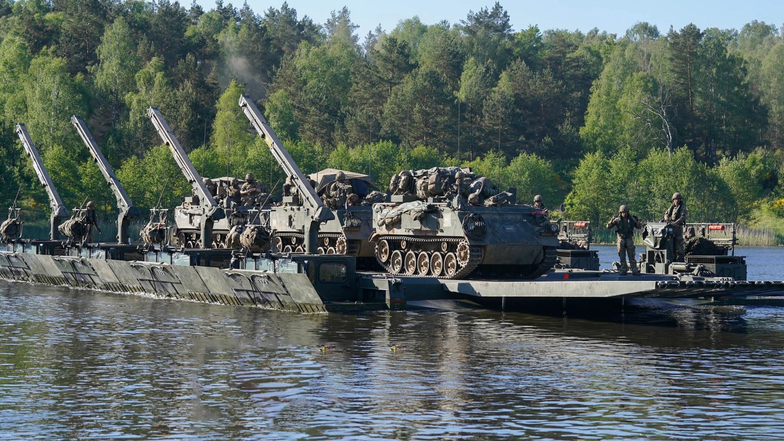 Watch crack Brit troops build river crossing in just minutes as part of largest Nato war game since end of Cold War