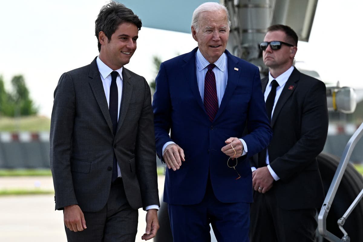 Biden marks D Day anniversary in Europe and underscores Trumps looming threat