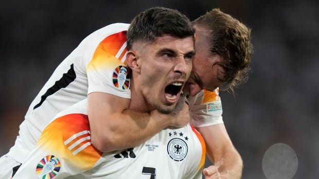 Host Germany kicks off Euro with 4-goal victory over 10-man Scotland