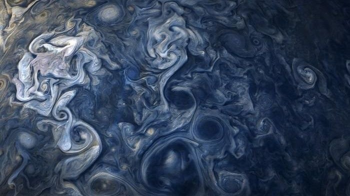 An image of blue swirlies on Jupiter