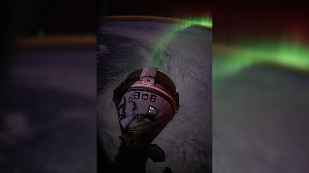 a cone shaped spacecraft in front of a green aurora above the earth which is in shadow