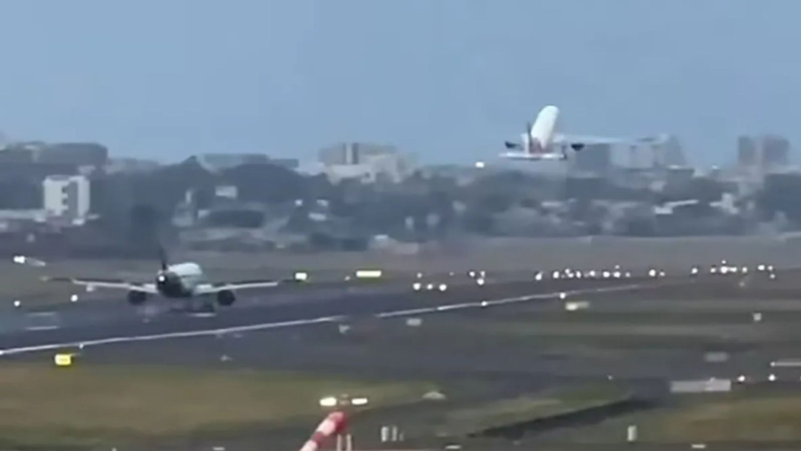 Terrifying moment passenger plane lands just metres behind another at Mumbai airport in heart stopping near miss