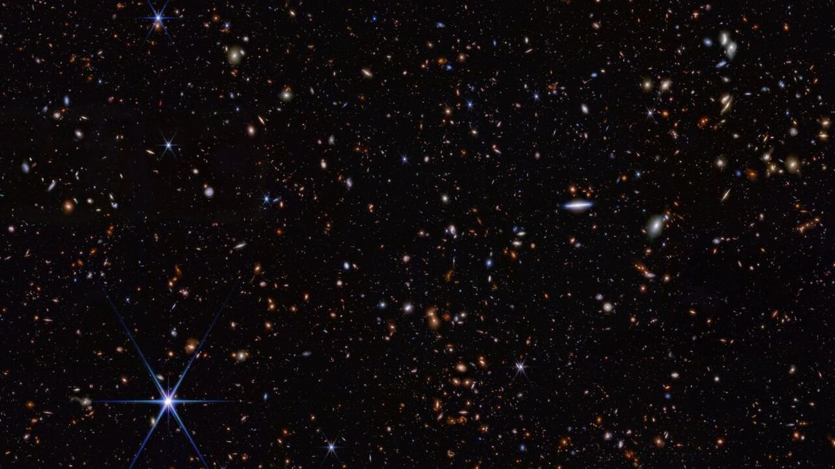 telescope photo showing hundreds of galaxies in deep space