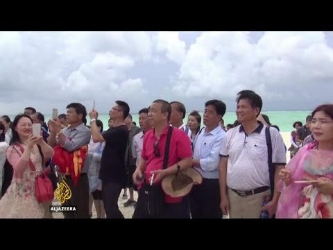 Tourists taken to disputed South China Sea islands
