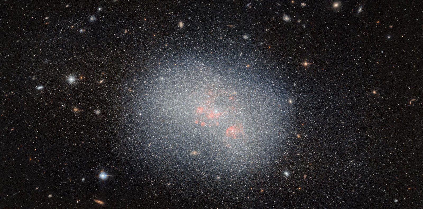 Hubble Reveals How Dwarf Galaxies Shape the Largest Galaxies