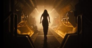 A woman stands in a backlit spaceship corridor