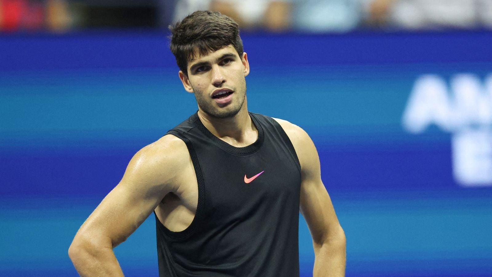 Spain's Carlos Alcaraz reacts as he plays against Australia's Li Tu during their men's singles first round match on day two of the US Open tennis tournament at the USTA Billie Jean King National Tennis Center in New York City, on August 27, 2024. (Photo by CHARLY TRIBALLEAU / AFP)