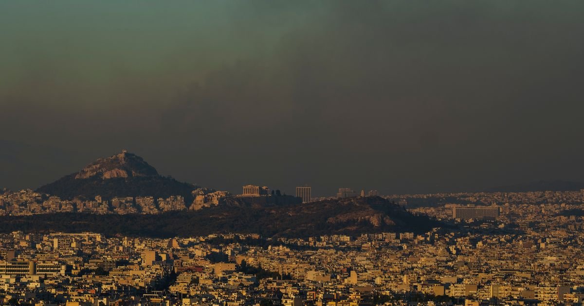 Crews battle scattered fires in Athens suburbs, helped by calmer winds and reinforcements