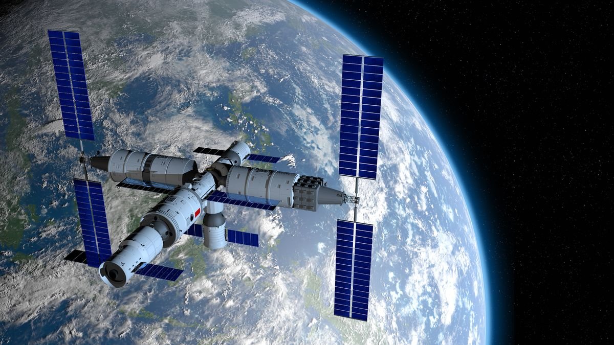 artist's illustration of Chinese space station Tiangong above Earth in the background.