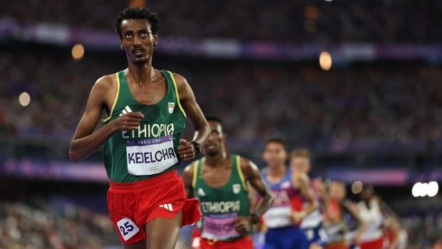 Ethiopian runner Yomif Kejelcha breaks the men's half-marathon world record