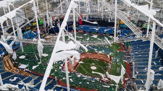 Hurricane Milton tears roof off domed home of MLB's Tampa Bay Rays and litters field