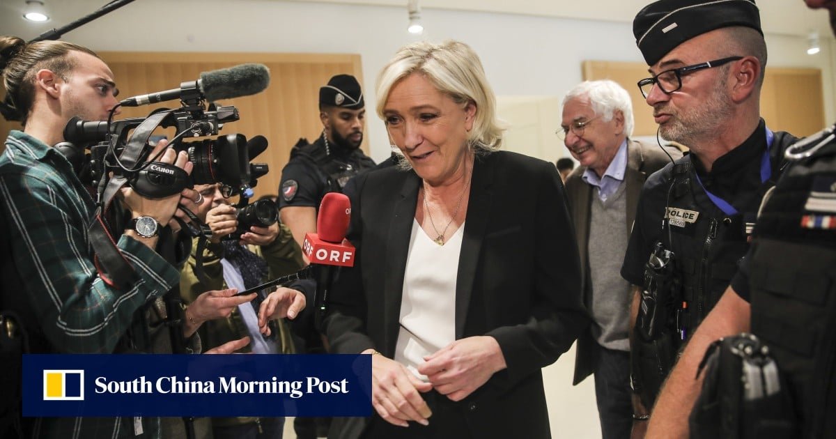 In EU embezzlement trial, French far-right leader Le Pen answers questions about aides