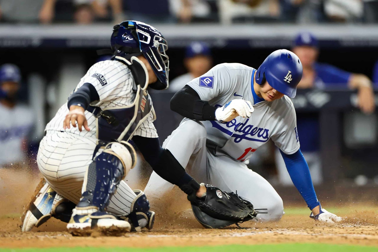 World Series MLB Shohei Ohtani #17 of the Los Angeles Dodgers slides safely into home plate against the New York Yankees at Yankee Stadium